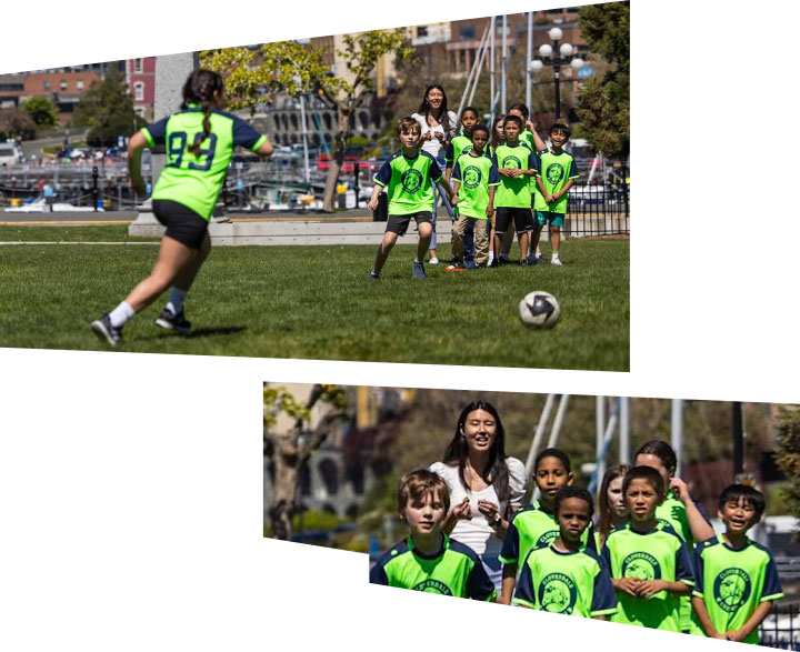 A group of children plays soccer on the lawn of the B.C. Legislature building.