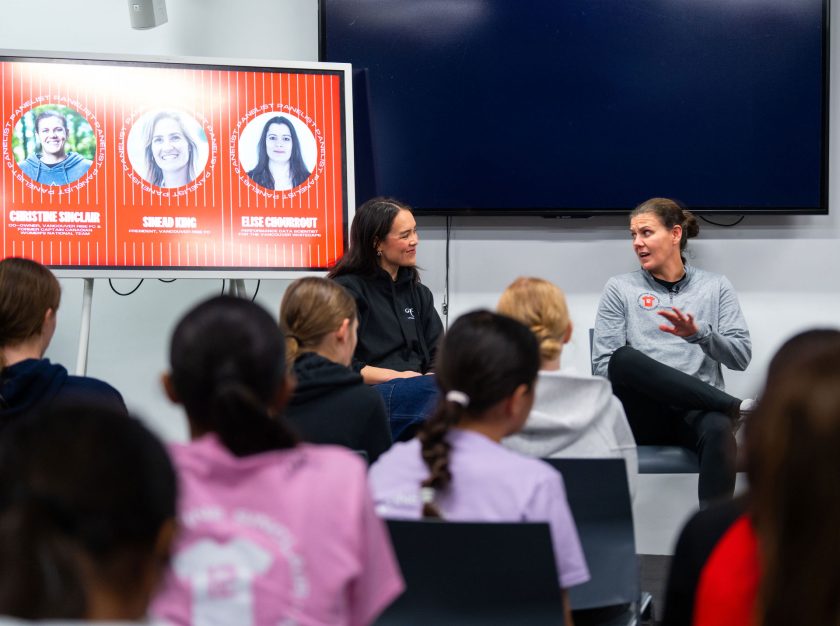 Christine Sinclair co-chairing a discussion in a room of young girls at the Sinclair Soccer Summit – clicking this link will open a larger version of it in the browser window.