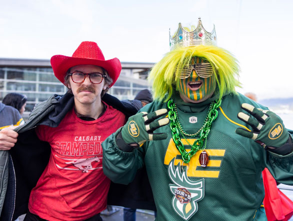 Two dedicated football fans dressed in their team colours at the 2024 Grey Cup Festival.