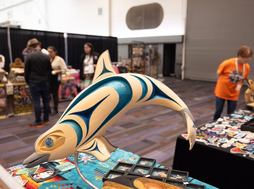 A beautifully carved and painted wooden dolphin at the Indigenous Marketplace of the 2024 Grey Cup Festival – clicking this link will open a larger version of it in the browser window.
