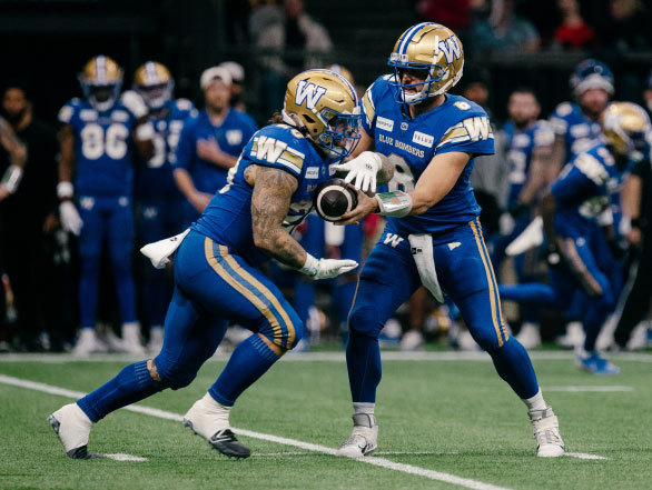 The Winnipeg Blue Bombers engaging in a running play during the 2024 Grey Cup.