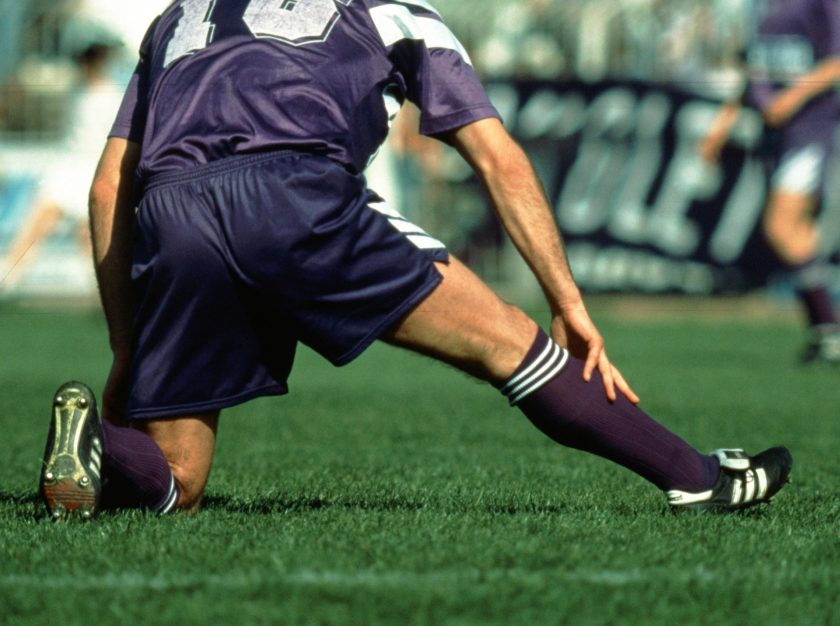 A soccer player slides to make a play – clicking this link will open a larger version of it in the browser window.