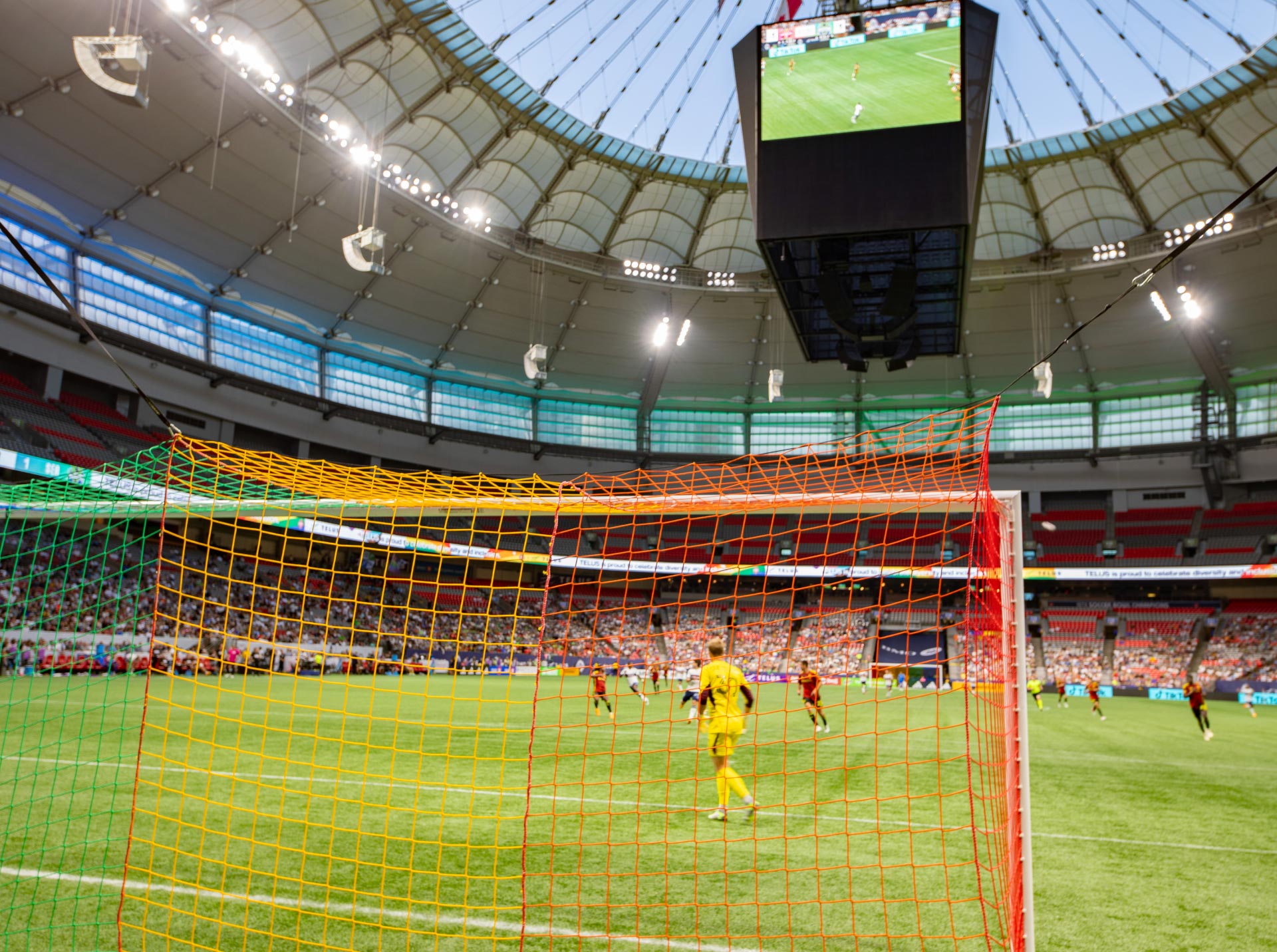 A photo from behind the net looking across the field during a soccer match at BC Place – clicking this link will open a larger version of it in the browser window.