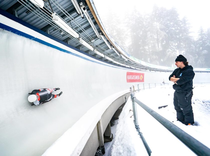 A Team Canada athlete speeding down the track at the 2023 FIL Luge World Championships – clicking this link will open a larger version of it in the browser window.