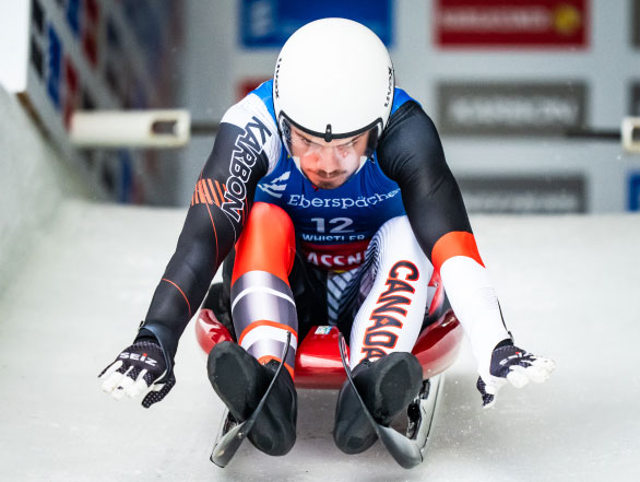 A Team Canada athlete starts their luge run at the 2023 FIL Luge World Championships.