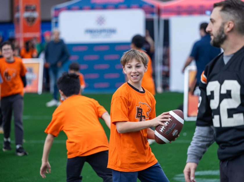 A young boy prepares to throw a football during a football practice – clicking this link will open a larger version of it in the browser window.