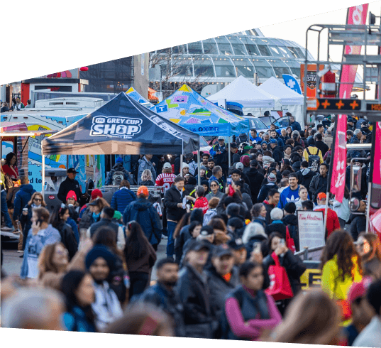 A crowd of people in the street at the 2024 Grey Cup Festival.
