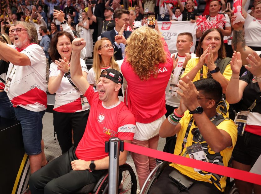 Two men in wheelchairs in the front row among a crowd of cheering fans – clicking this link will open a larger version of it in the browser window.