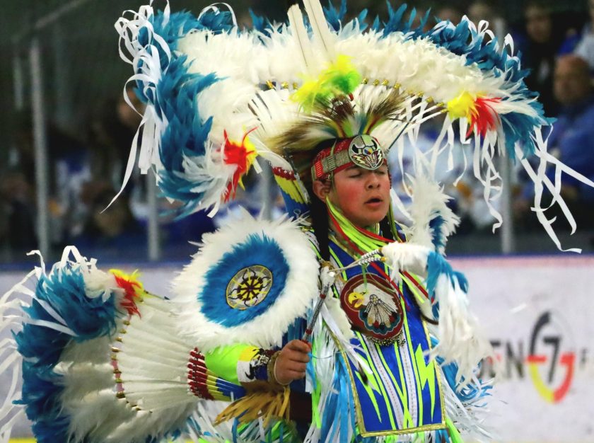 A dancer performs a powwow dance during a ceremony at the 2024 National Aboriginal Hockey Championships – clicking this link will open a larger version of it in the browser window.