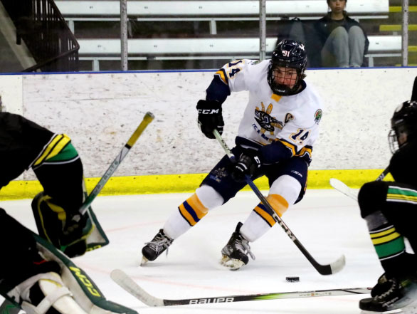 A player for TeamBC lines up a shot at the 2024 National Aboriginal Hockey Championships.