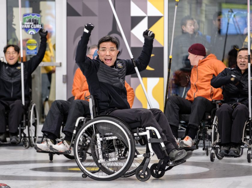 Curling competitors in adaptive sporting equipment celebrate at the 2025 Invictus Games – clicking this link will open a larger version of it in the browser window.