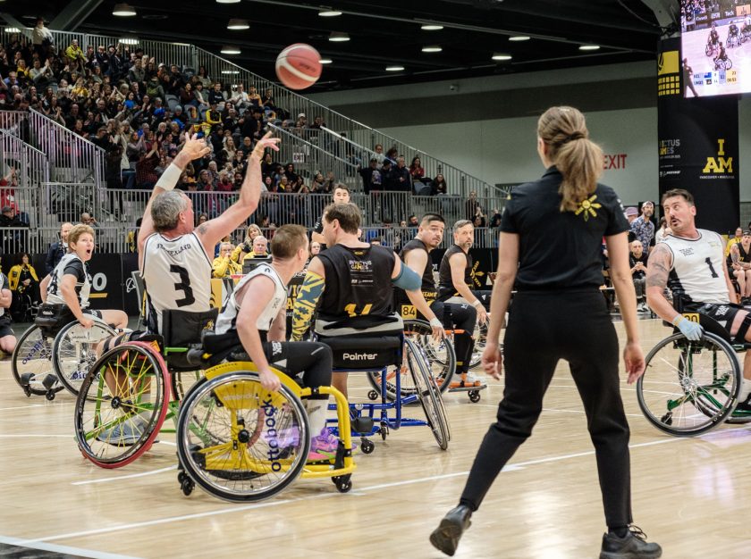 Competitors in adaptive sporting equipment participate in a basketball event at the 2025 Invictus Games – clicking this link will open a larger version of it in the browser window.