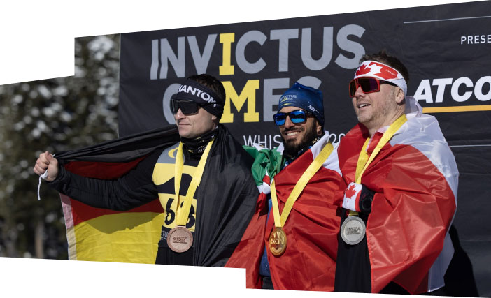 Competitors stand on the podium with their medals at the 2025 Invictus Games.